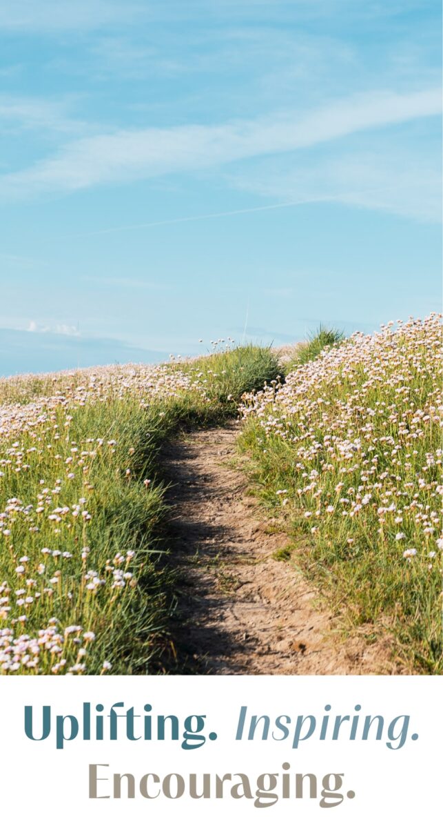 A dirt path winding through a field of wildflowers under a bright blue sky, with the words 'Uplifting. Inspiring. Encouraging.' displayed below.